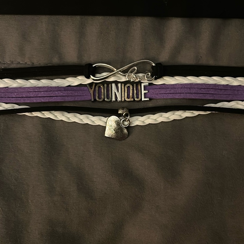 Brand new inbox, Younique, purple, white, and black representative bracelet